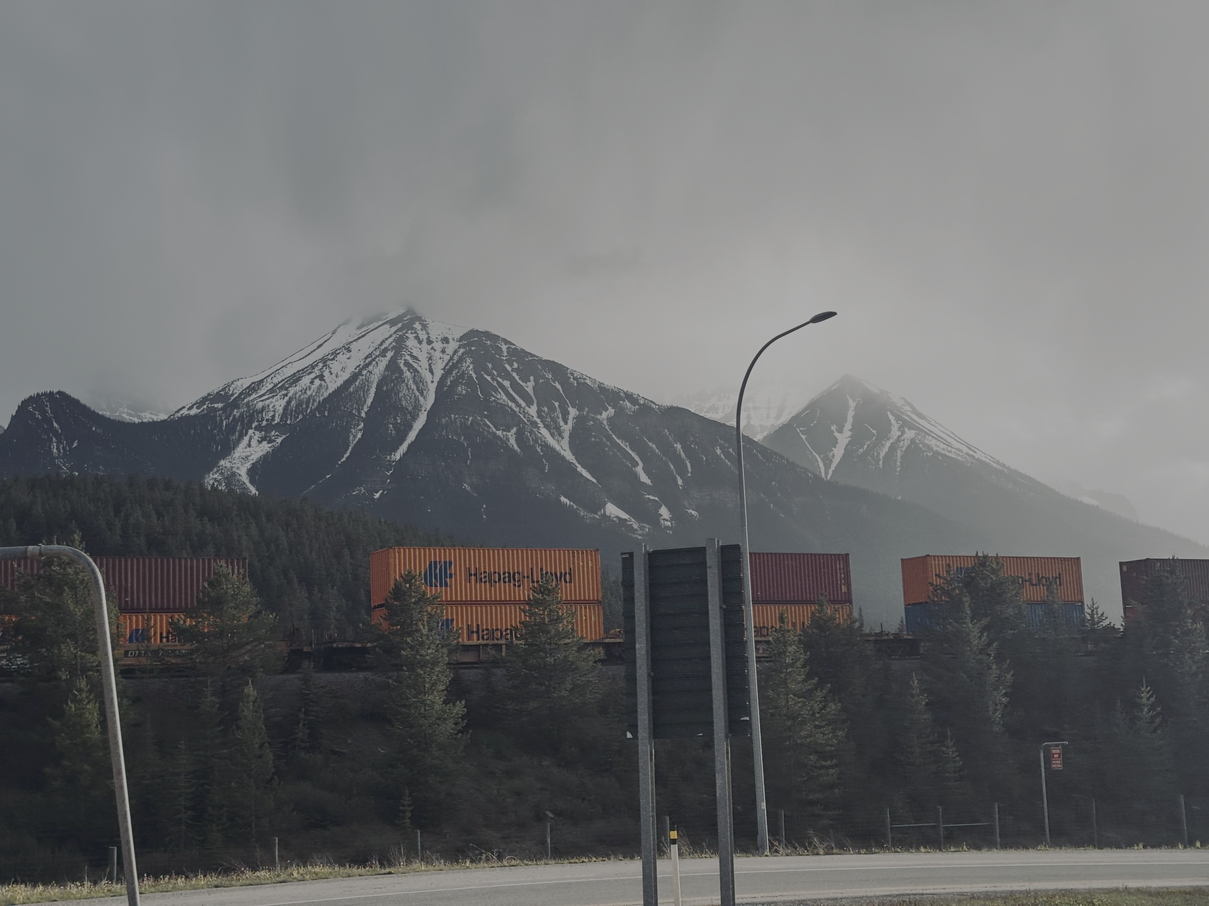 Snow-covered mountains and freight trains in Banff
